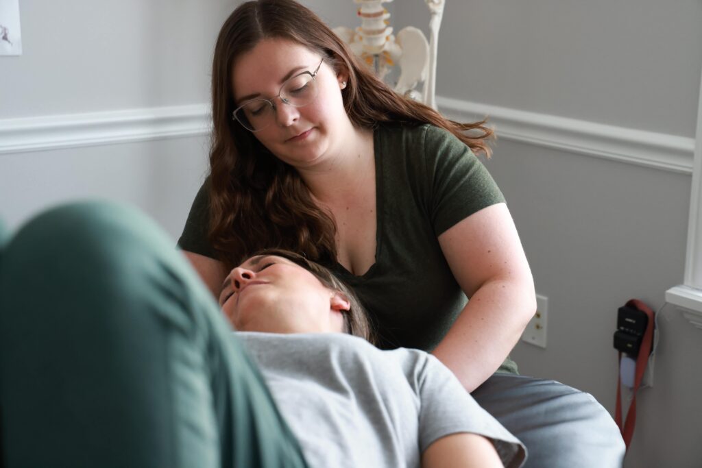 Brenna performing RAPID NeuroFascial Reset therapy on a patient